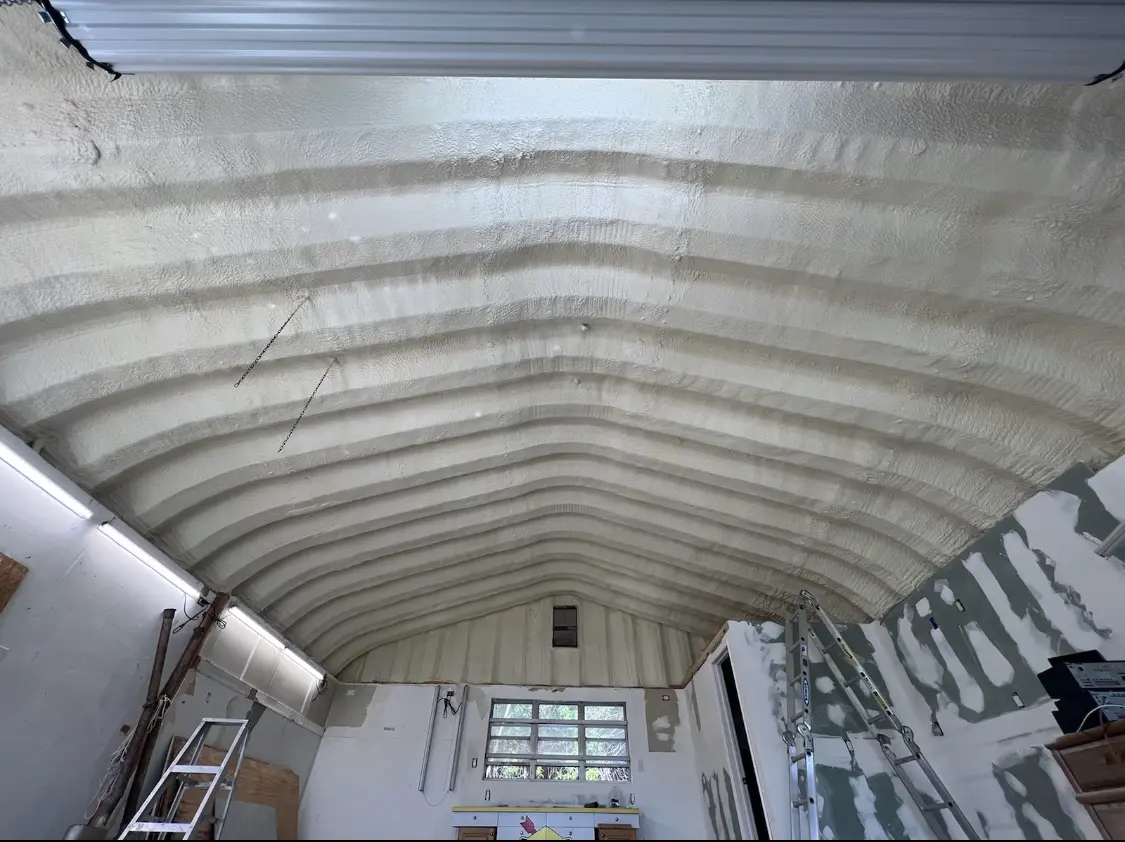 Spray polyurethane foam applied to the underside of a metal roof deck in East Wenatchee